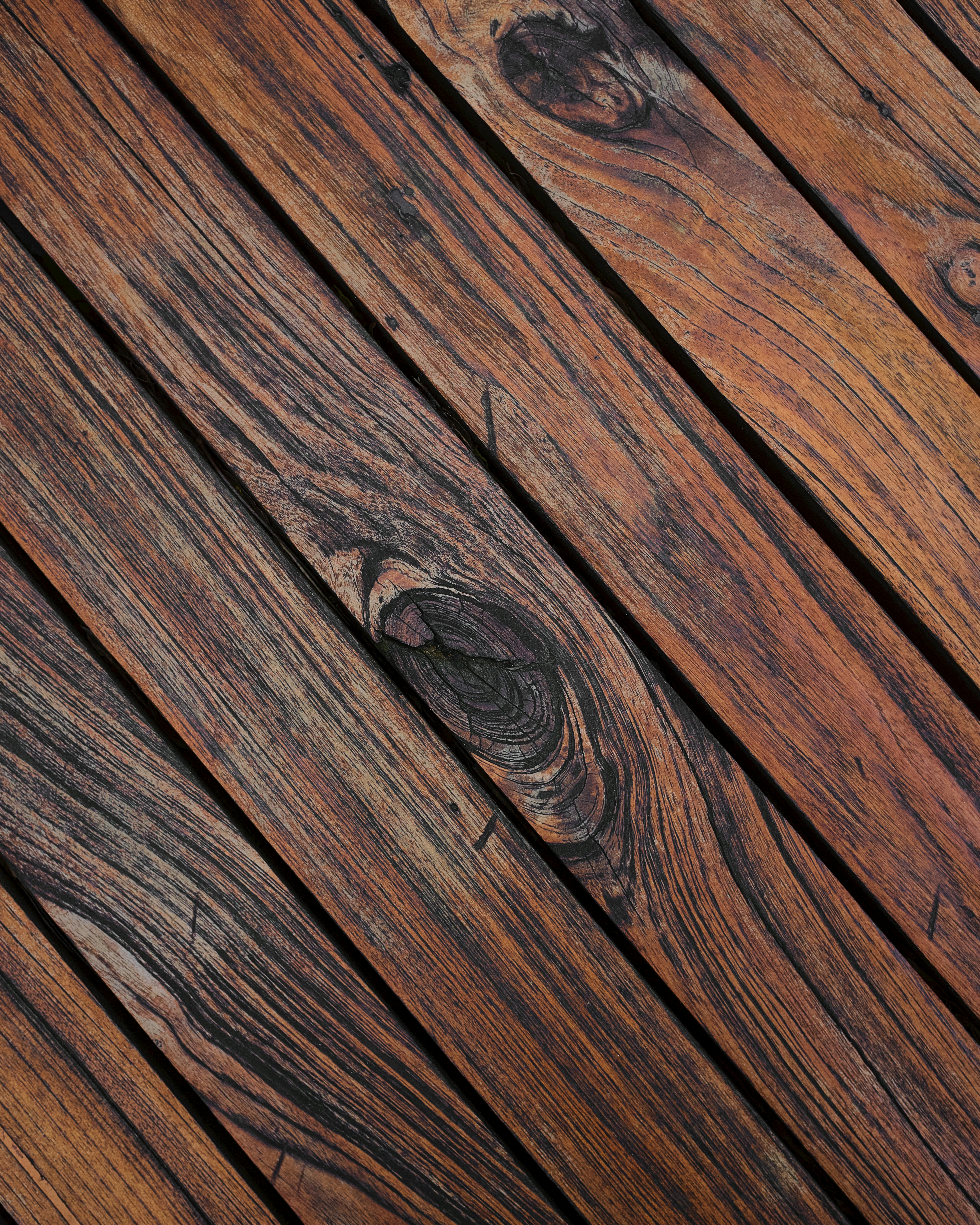 Detailed view of weathered wooden planks showing natural grain and texture.